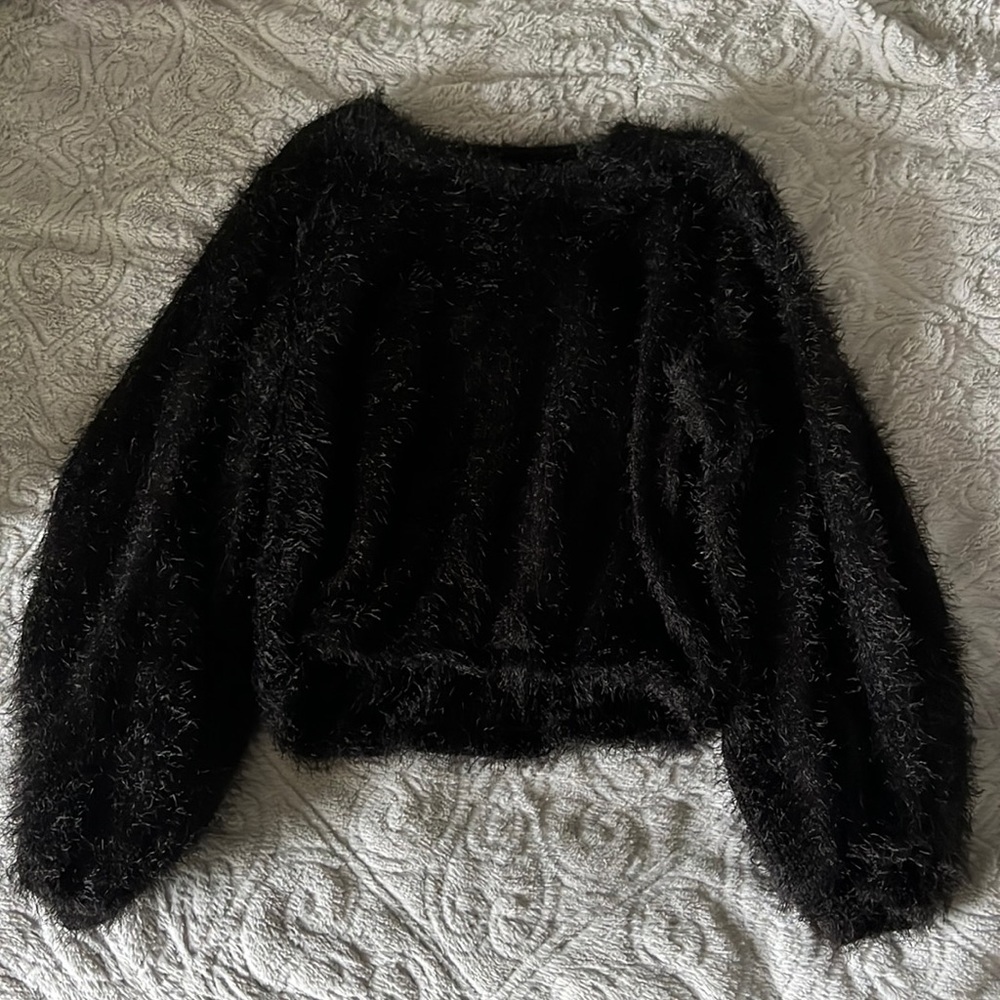 Fuzzy black short sweater.